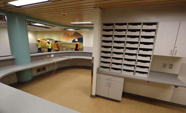 Visitors tour the Columbia Valley Center for Recovery in downtown Kennewick to see the construction progress of the facility.
